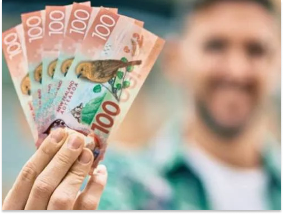 Happy customer holding instant cash after selling car in Hastings.